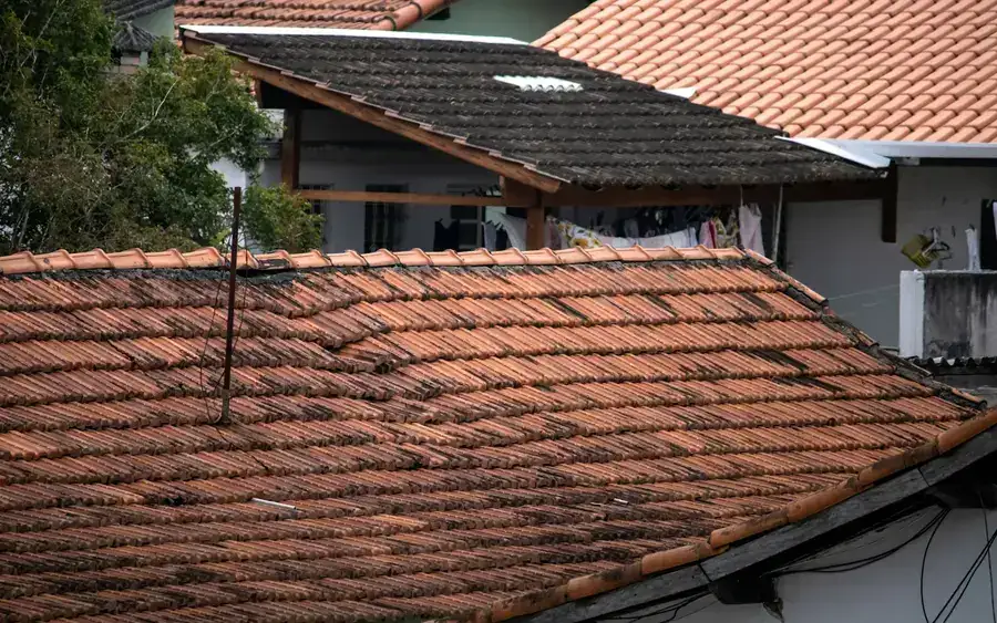 Before: a tired, leaking roof covering in poor condition