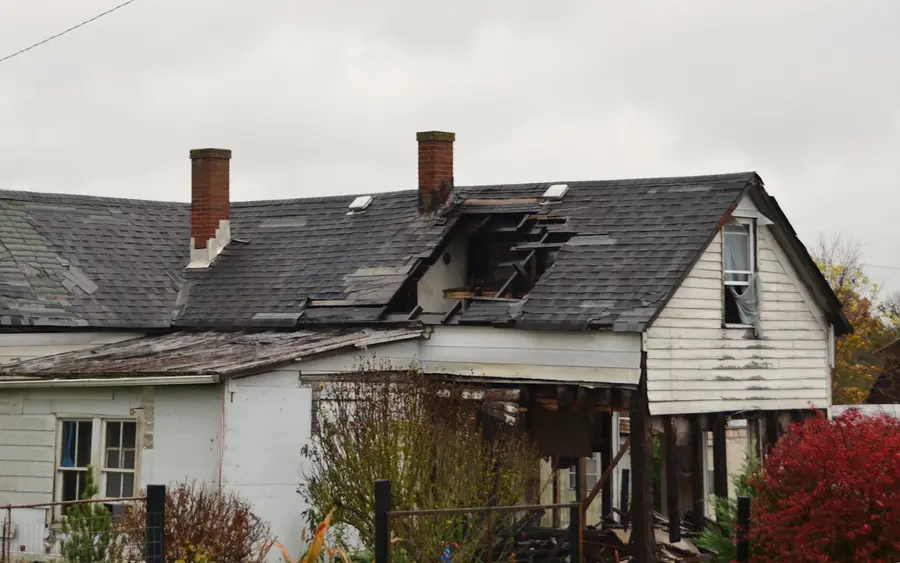 Before: a storm-damaged roof with displaced tiles, exposed to the weather