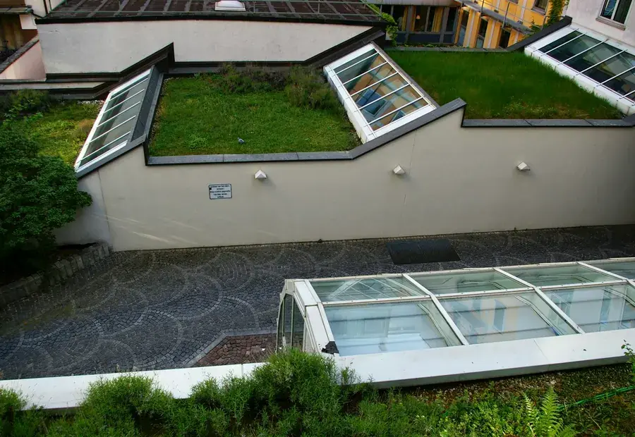 A modern flat roof extension with roof lights and a clean membrane finish